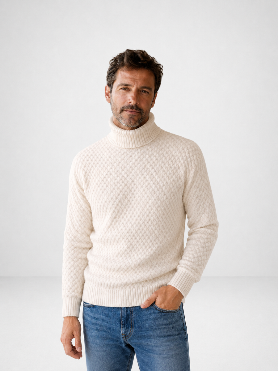 Suéter de punto texturizado con cuello alto y patrón acolchado en rombos.